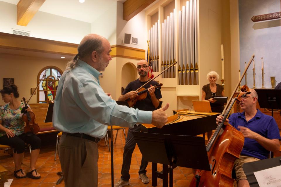 Alex Goldstein speaks to musicians during a rehearsal with the Camerata of Naples, Monday, May 2, 2022, at St. John’s Episcopal Church in Naples, Fla.Alex Goldstein, who is known around the skating world as a terrific programmer for ice dance and pairs music – his skaters have won handfuls of Olympic medals – has composed a set of seven variations on a theme by Albinoni. Its U.S. premiere is Sunday with the Camerata of Naples.
