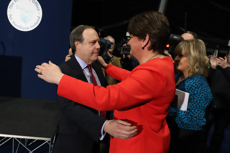 The DUP's Nigel Dodds is embraced by leader Arlene Foster after losing the Belfast North seat at the Titanic exhibition centre, Belfast, for the 2019 General Election. (Photo by Liam McBurney/PA Images via Getty Images)