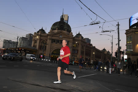Australian Opposition Leader Bill Shorten is seen during a morning run in Melbourne, Australia, May 18, 2019. AAP Image/Lukas Coch/via REUTERS