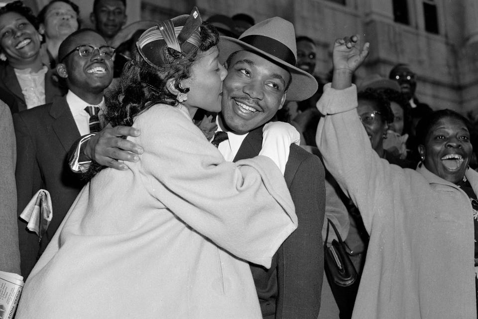 Martin Luther King Jr. is welcomed with a kiss from his wife, Coretta Scott King, after leaving court in Montgomery, Ala., on March 22, 1956. (Gene Herrick / AP)