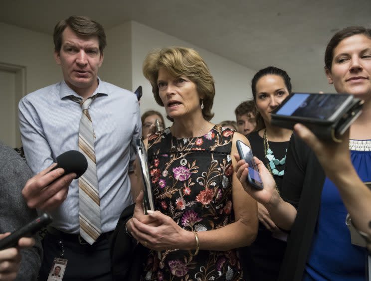 Sen. Lisa Murkowski, R-Alaska, and other lawmakers head to the Senate on July 13 for a meeting on the revised Republican health care bill, which has been under attack from within the party, including Murkowski. (AP Photo/J. Scott Applewhite)