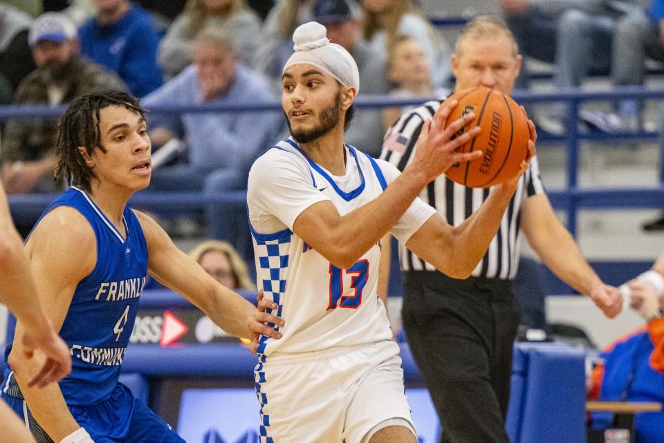 Whiteland High School senior Jaskirat Banwait (13) looks for a pass to make during the first half of an IHSAA basketball game against Franklin Community High School, Tuesday, Jan. 9, 2024, at Whiteland High Schooll.