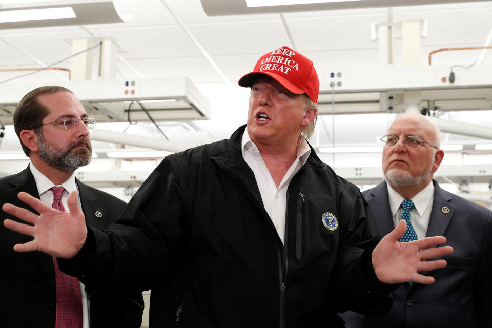 President Donald Trump delivers remarks beside HHS Secretary Alex Azar and Centers for Disease Control and Prevention Director Dr. Robert Redfield during a tour of the Center for Disease Control (CDC) following a COVID-19 coronavirus briefing in Atlanta, Georgia on March 6, 2020. (Tom Brenner/Reuters)