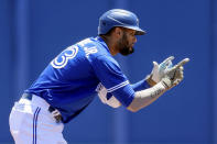 Toronto Blue Jays' Lourdes Gurriel Jr., celebrates after hitting a double against the Philadelphia Phillies during the third inning of a baseball game Sunday, May 16, 2021, in Dunedin, Fla. (AP Photo/Mike Carlson)