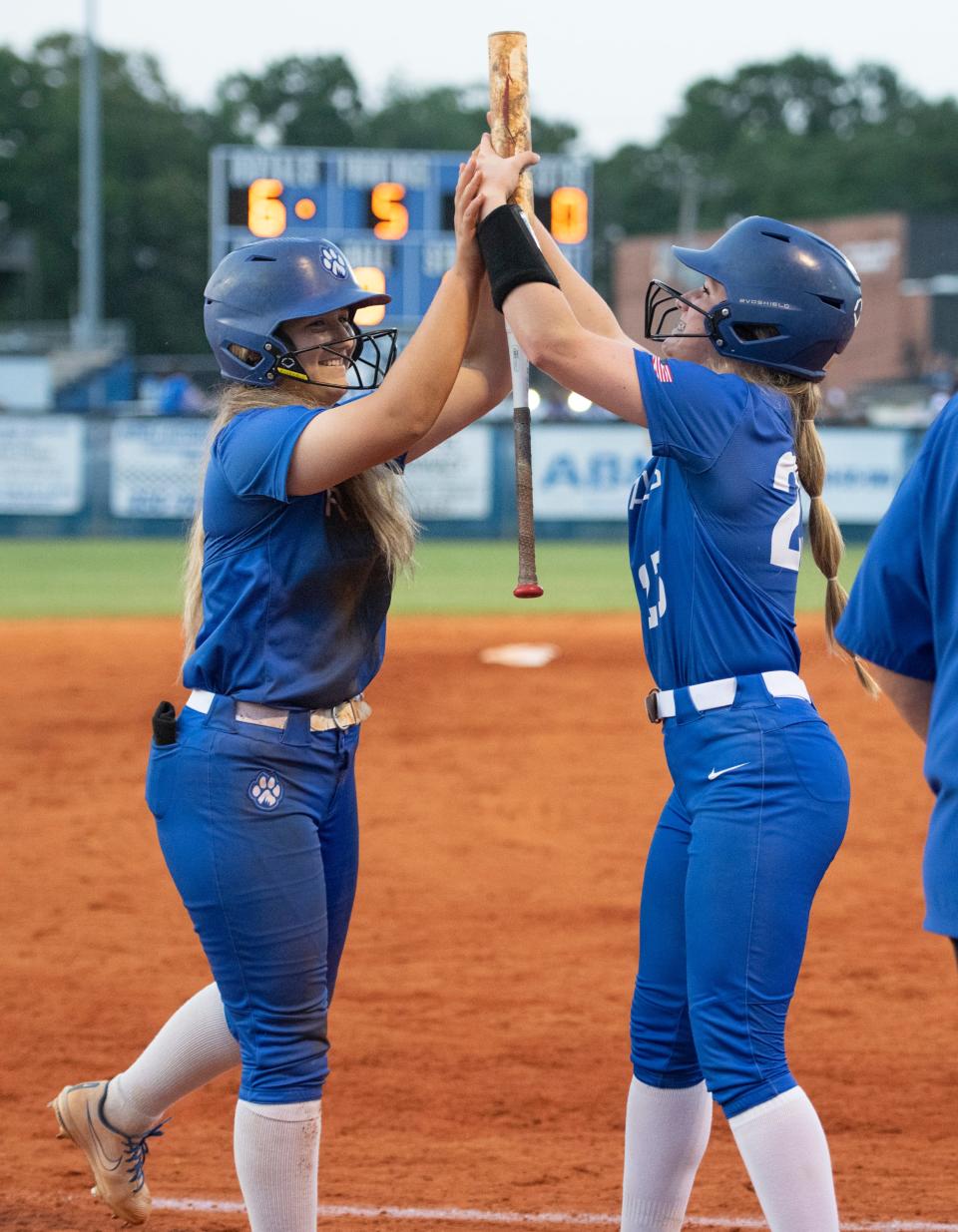 Brooklyn Sorrells (12) and Kaylee Gilbreath (23) celebrate taking a 6-0 lead during the Northview vs Jay 1A regional semifinal playoff softball game at Jay High School on Thursday, May 12, 2022.