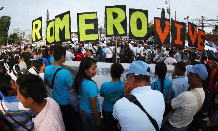 Catholics participate in a mass celebrating the beatification of Salvadorean archbishop Oscar Romero at the Salvador del Mundo square in San Salvador on May 23, 2015