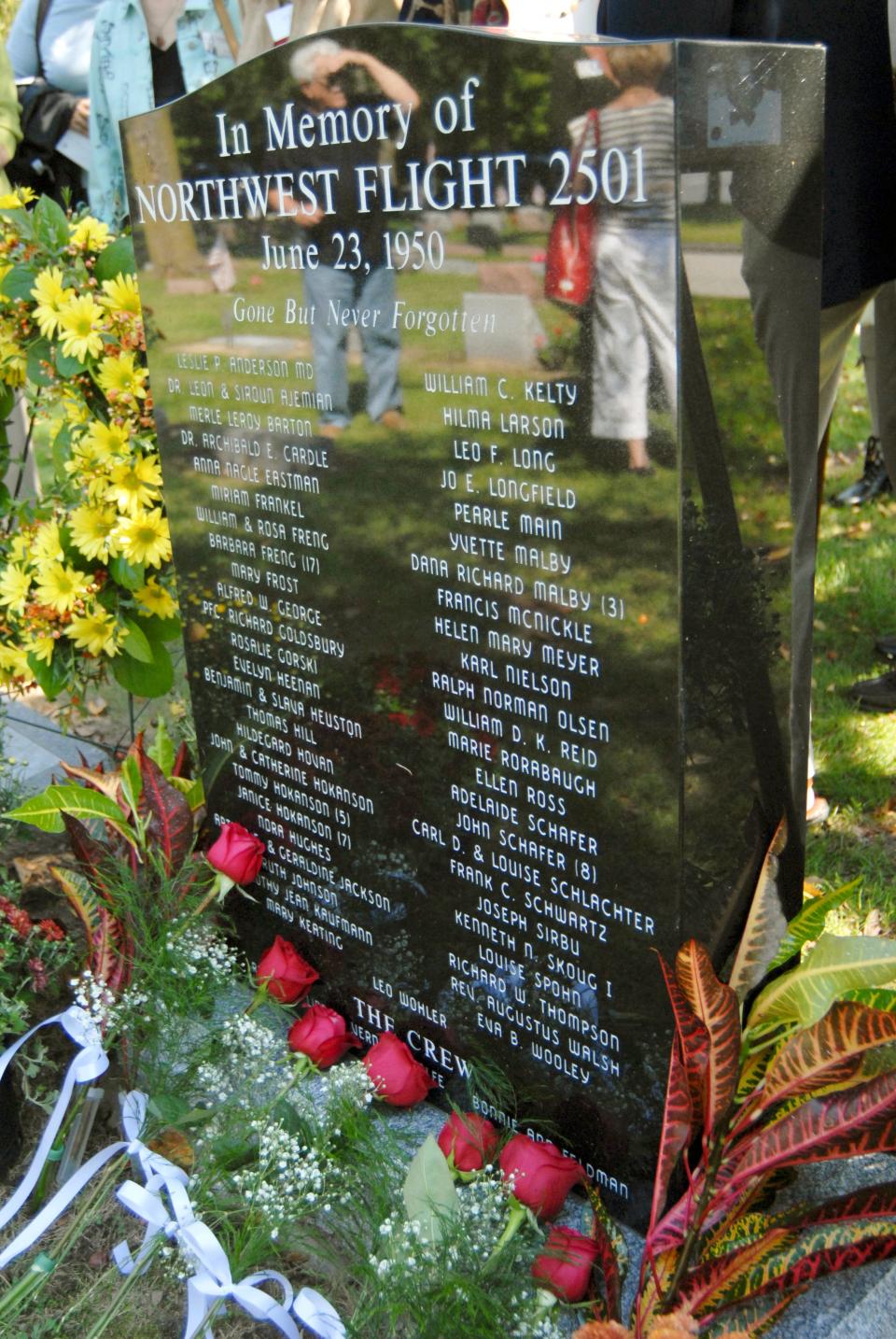 A black granite memorial marker engraved with the names of the 58 victims is shown on Sept. 20, 2008, at Riverview Cemetery in St. Joseph, Mich. during a memorial service for victims of Northwest Flight 2501, which crashed into Lake Michigan on June 23, 1950. The service included the placement of The search continues for the location of the plane.