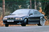 <p>After <strong>dabbling</strong> with a V10 motor, the BMW M5 is now back with a V8 after this design of engine first made its appearance in the <strong>E39</strong> M5. It was an instant hit thanks to the 5.0-litre V8’s <strong>394bhp</strong> punch that could see it from 0-60mph in 5.3 seconds on to a limited 155mph, or considerably more if derestricted.</p><p>The 4941cc all-alloy 32-valve V8 was a technical show of strength from BMW, featuring <strong>drive by wire</strong> throttles and individual throttle bodies. Known as the S62, the engine was also the first to have double <strong>VANOS</strong> variable valve timing, making the most advanced road car engine BMW had produced up to that point.</p>