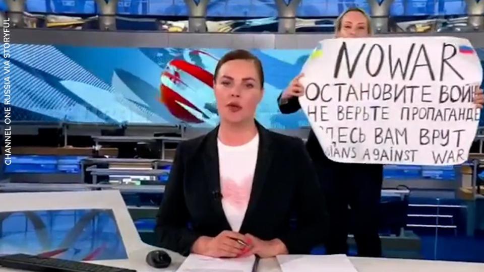 Screen shot of Marina Ovsyannikova protesting during Russian broadcast.