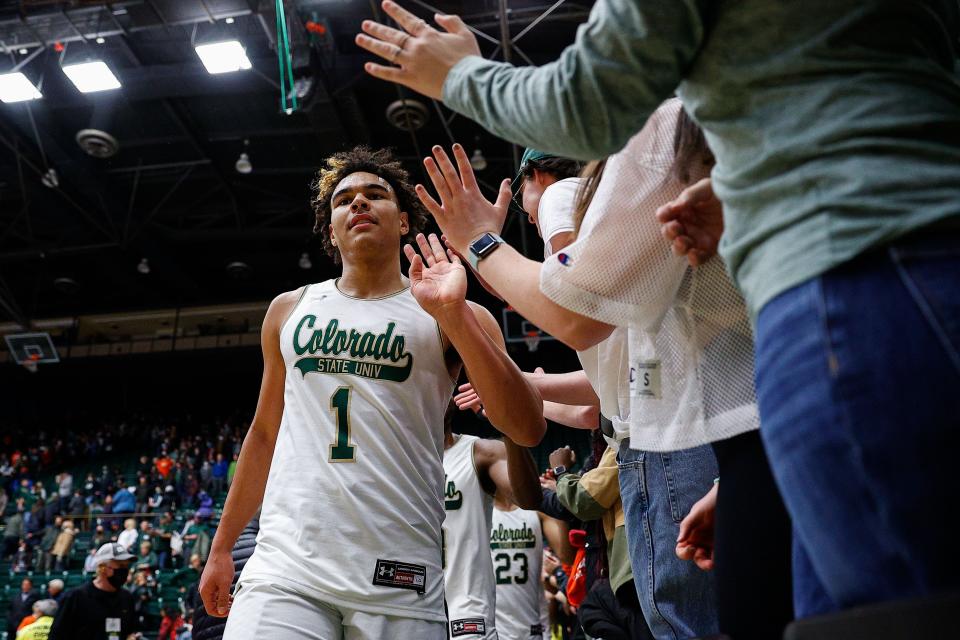Colorado State guard John Tonje (1) greets fans after a Feb. 2022 game against the Fresno State Bulldogs at Moby Arena.