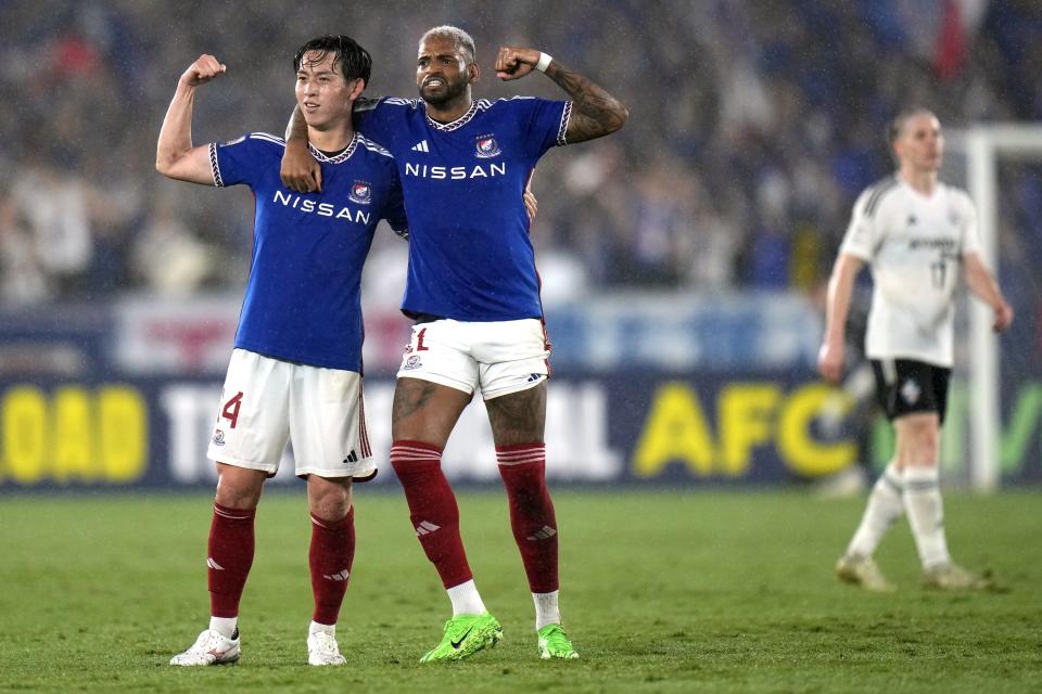 Yokohama F. Marinos' Asahi Uenaka, left, celebrates his goal with teammate Anderson Lopes, right, during the second leg of the AFC Champions League semifinal soccer match between Yokohama F. Marinos and Ulsan Hyundai in Yokohama, south of Tokyo, Wednesday, April 24, 2024.(AP Photo/Shuji Kajiyama)