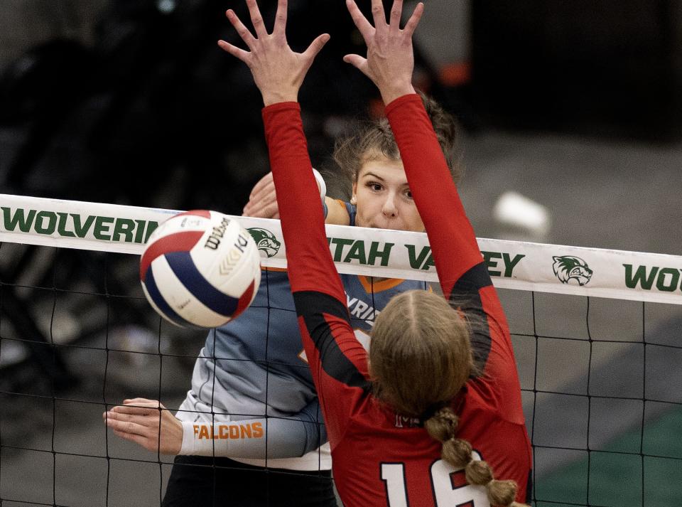 Skyridge’s Cala Cooper hits the ball past Mountain Ridge’s Addyson Cook during 6A volleyball state tournament quarterfinals at Utah Valley University in Orem on Thursday, Nov. 2, 2023. | Laura Seitz, Deseret News