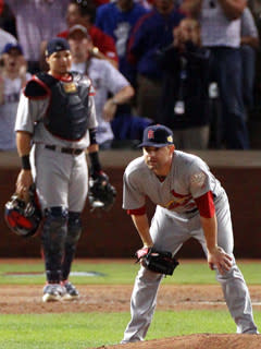 St. Louis pitcher Marc Rzepczynski and catcher Yadier Molina react to the two-run double hit by Rangers catcher Mike Napoli in Game 5 of the World Series