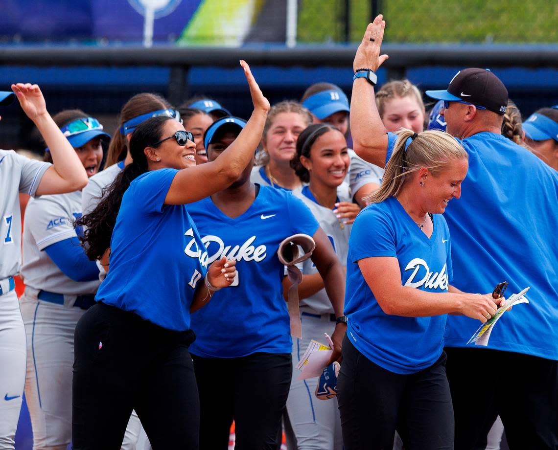 Duke head coach Marissa Young gets a high-five following the Blue Devils’ 4-3 victory over Clemson in the ACC Tournament semifinals on Friday, May 10, 2024, in Durham, N.C.