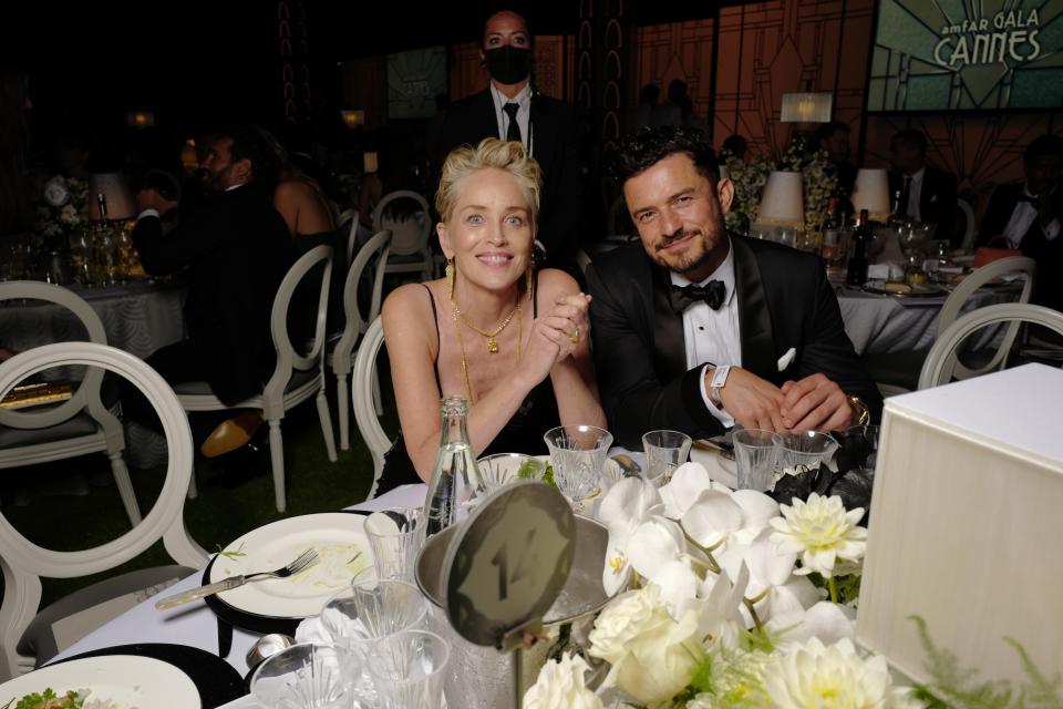 Sharon Stone and Orlando Bloom - Credit: Stephane Feugere / WWD