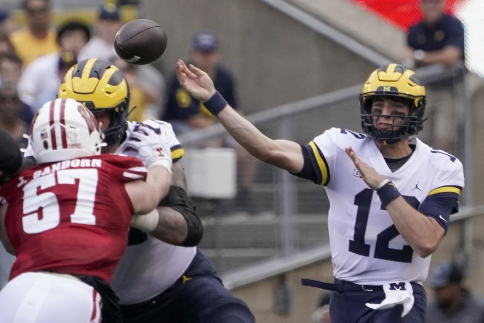 Michigan's Cade McNamara throws during the first half of an NCAA college football game against Wisconsin Saturday, Oct. 2, 2021, in Madison, Wis. (AP Photo/Morry Gash)