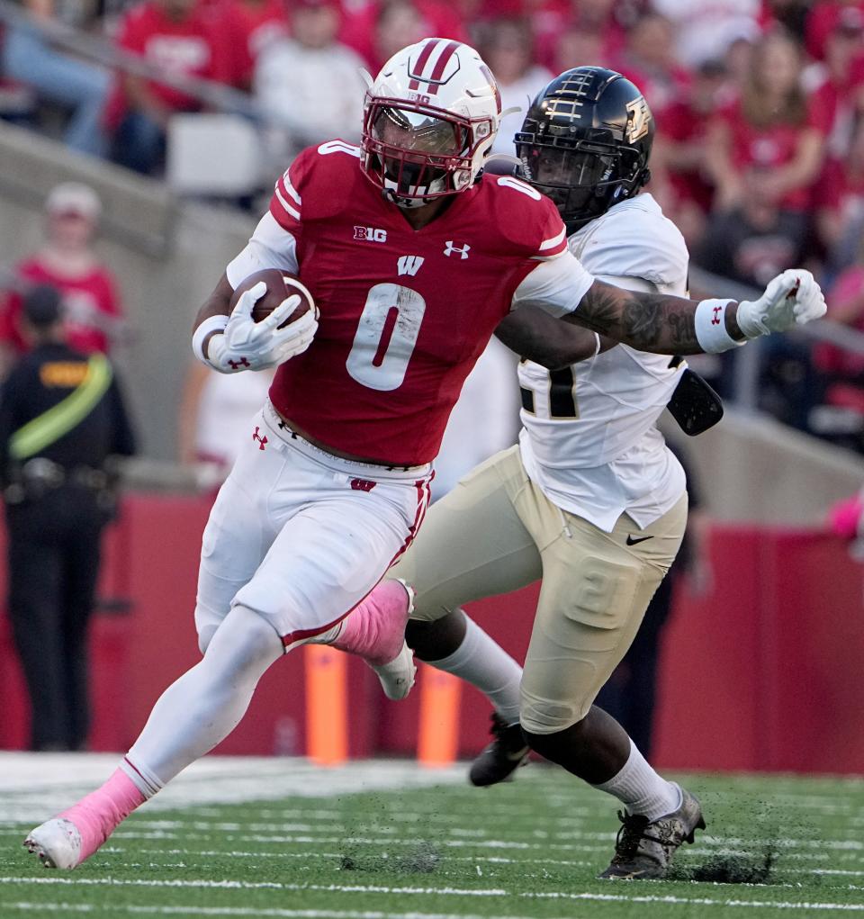 Wisconsin running back Braelon Allen (0) picks up 29 yards on a reception during the fourth quarter of their game at Camp Randall Stadium Saturday, October 22, 2022 in Madison, Wis.Wisconsin beat Purdue 35-24.