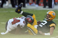 Green Bay Packers quarterback Aaron Rodgers (12) gets sacked by Tampa Bay Buccaneers inside linebacker Lavonte David (54) during the first half of an NFL football game Sunday, Oct. 18, 2020, in Tampa, Fla. (AP Photo/Jason Behnken)