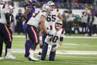 New England Patriots quarterback Mac Jones (10) reacts after getting sacked during the second half of an NFL football game against the Minnesota Vikings, Thursday, Nov. 24, 2022, in Minneapolis. The Vikings won 33-26. (AP Photo/Bruce Kluckhohn)