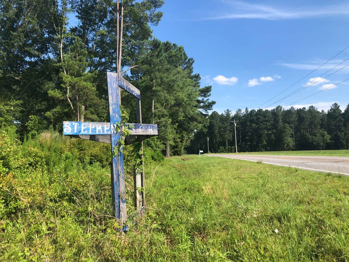 A wooden memorial on the side of Sandy Run Road, where 19-year-old Stephen Smith was found dead in 2015.