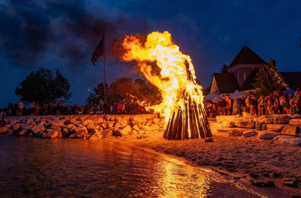 A bonfire on the shore of Eagle Harbor helps bring Fyr Bal to a close. The Ephraim Business Council's annual Scandinavian-style daylong celebration of the end of winter and arrival of summer takes place in the village June 15.