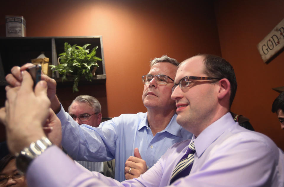 Former Florida Governor Jeb Bush takes a selfie with an Iowa resident after speaking at a Pizza Ranch restaurant on March 7, 2015 in Cedar Rapids, Iowa. (Photo by Scott Olson/Getty Images)
