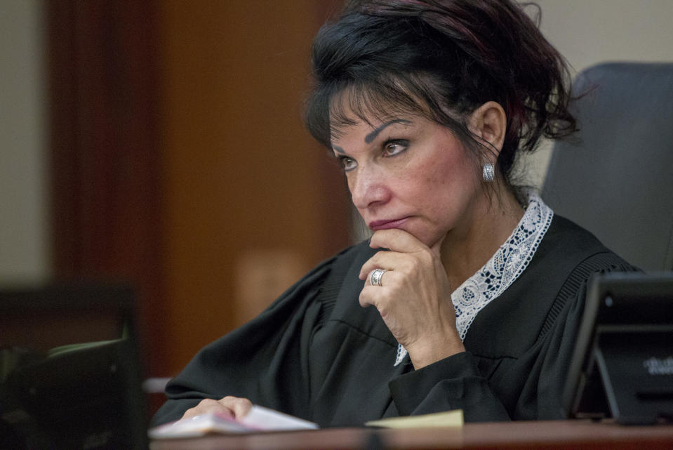 FILE - Judge Rosemarie Aquilina presides at Ingham County 30th Circuit Court in Lansing, Mich., on June 6, 2018. The Michigan Supreme Court on Friday rejected a final appeal from sports doctor Larry Nassar, who was sentenced to decades in prison for sexually assaulting gymnasts, including Olympic medalists. Attorneys for Nassar said he was treated unfairly in 2018 and deserved a new hearing, based on vengeful remarks by a judge who called him a "monster" who would "wither" in prison like the wicked witch in "The Wizard of Oz." (Cory Morse /The Grand Rapids Press via AP)/