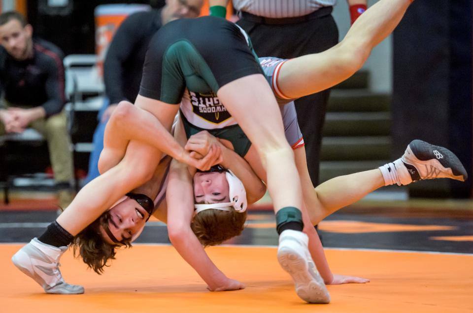 Morton's Payton Ferrill and Richwoods' Gabe Robb get upside down during their 120-pound match of the Class 2A wrestling regional Saturday, Feb. 4, 2023 at Washington Community High School. Ferrill took the regional title 13-5.