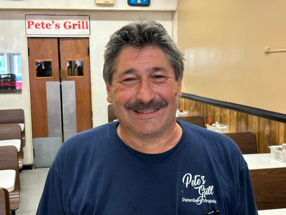 Pete Karousos, owner of Pete's Grill in Petersburg, strikes a pose on July 16, 2024.