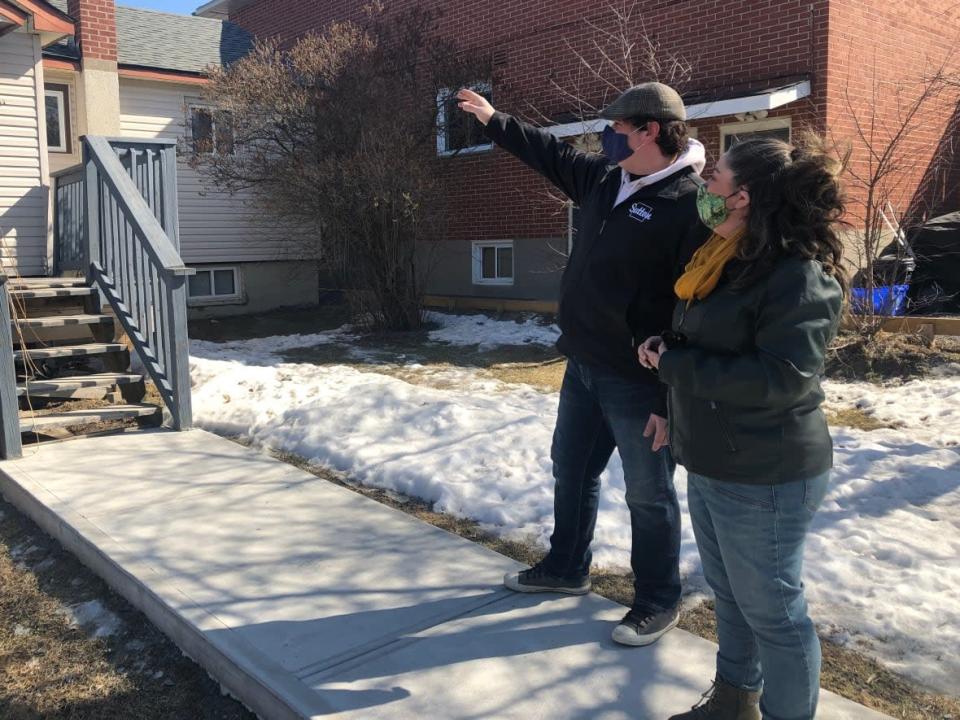 First-time homebuyer Amanda Pride, with the help of her realtor Kevin Belanger, has been searching for a house in Sudbury for two years. (Angela Gemmill/CBC - image credit)