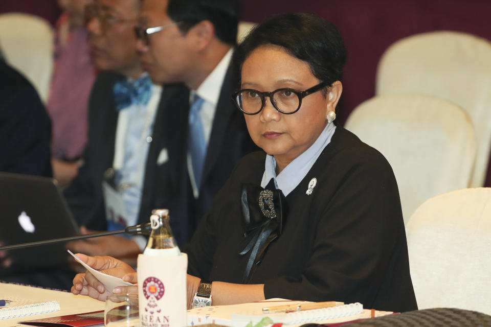 FILE - In this July 31, 2019, file photo, Indonesian Foreign Minister Retno Marsudi sits at the start of ASEAN Foreign Ministers meeting plenary session in Bangkok, Thailand. Foreign Minister Marsudi said in a video conference Sunday, May 10, 2020, from the capital, Jakarta, that 49 Indonesian fishermen, ranging from 19 to 24 years old, were forced to work an average of over 18 hours a day on at least four Chinese fishing boats. (AP Photo/Sakchai Lalit, File)