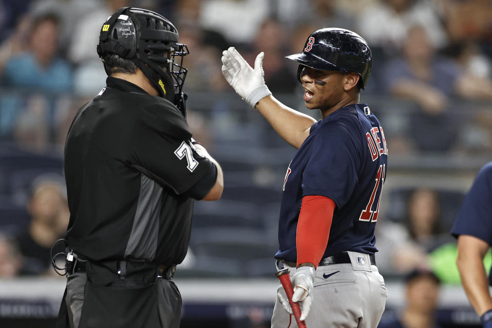 Boston Red Sox's Rafael Devers argues with home plate umpire Manny Gonzalez during the sixth inning of the team's baseball game against the New York Yankees on Sunday, July 18, 2021, in New York. (AP Photo/Adam Hunger)
