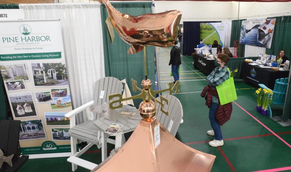 A copper whale waits for a breeze in the Pine Harbor Wood Products booth at the Hyannis Rotary Club's 63rd annual Home, Garden and Lifestyle Show, back after a two year pandemic break, hosted in the field house at Barnstable High School.