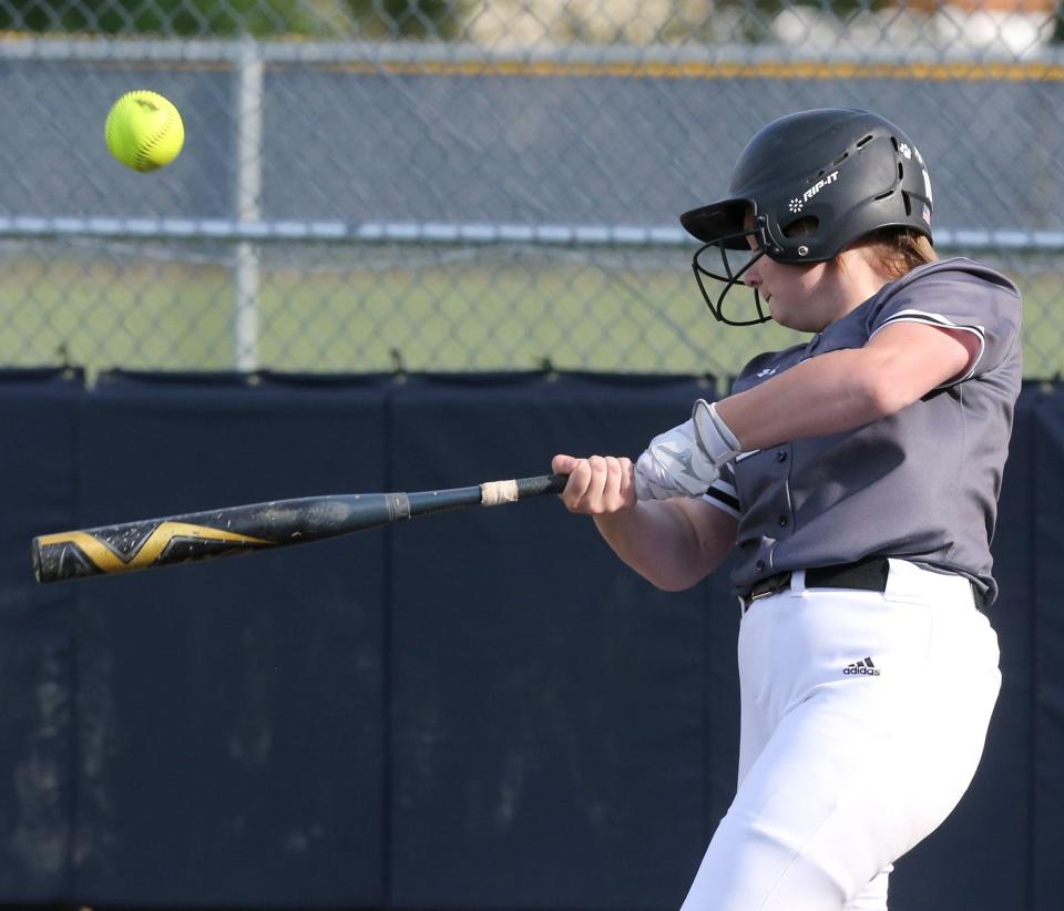 Maddie Elliott of Perry makes contact during Monday's Division I district semifinal game against Green in Austintown.