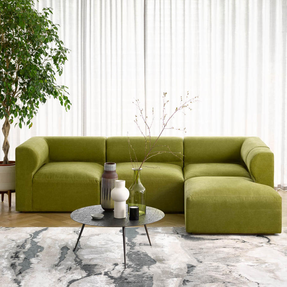 Green modular sofa in living room