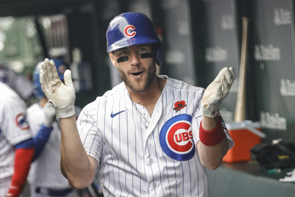May 31, 2021; Chicago, Illinois, USA; Chicago Cubs third baseman Patrick Wisdom (16) celebrates after hitting a solo home run against the San Diego Padres during the fourth inning at Wrigley Field. Mandatory Credit: Kamil Krzaczynski-USA TODAY Sports