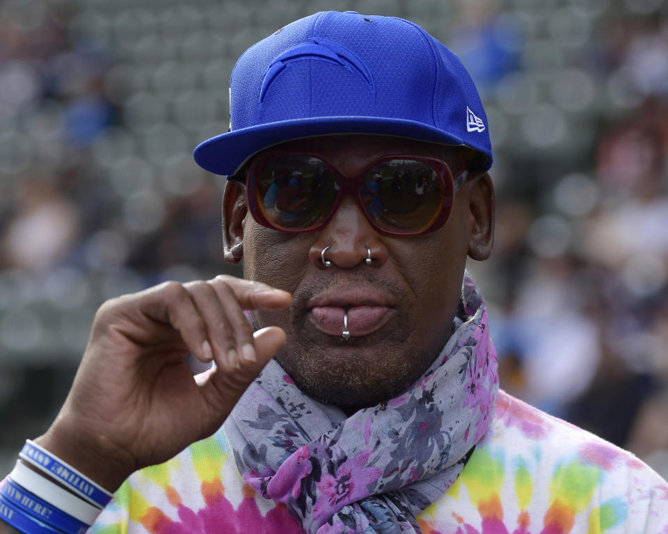 FILE - In this Dec. 9, 2018, file photo, former NBA basketball player Dennis Rodman attends an NFL football game between the Los Angeles Chargers and the Cincinnati Bengals in Carson, Calif. The owner of a Southern California yoga studio is accusing Dennis Rodman of helping three people steal more than $3,500 in merchandise from his business. Ali Shah says security cameras captured the former NBA star walking into Vibes Hot Yoga in Newport Beach on Tuesday, May 7, 2019, with his alleged accomplices. (AP Photo/Mark J. Terrill, File)