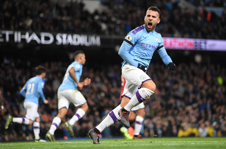 MANCHESTER, ENGLAND - DECEMBER 07: Nicolas Otamendi of Manchester City celebrates after scoring his team's first goal during the Premier League match between Manchester City and Manchester United at Etihad Stadium on December 07, 2019 in Manchester, United Kingdom. (Photo by Michael Regan/Getty Images)