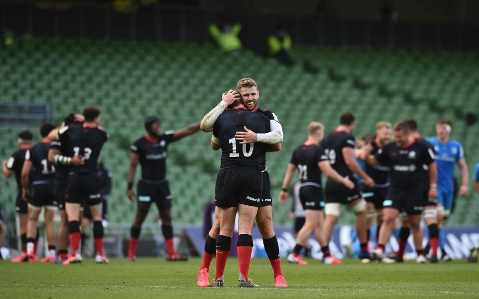 Alex Goode and Eliot Daly of Saracens celebrate after the Heineken Champions Cup Quarter Final match between Leinster and Saracens at Aviva Stadium on September 19, 2020 in Dublin, Ireland. - GETTY IMAGES