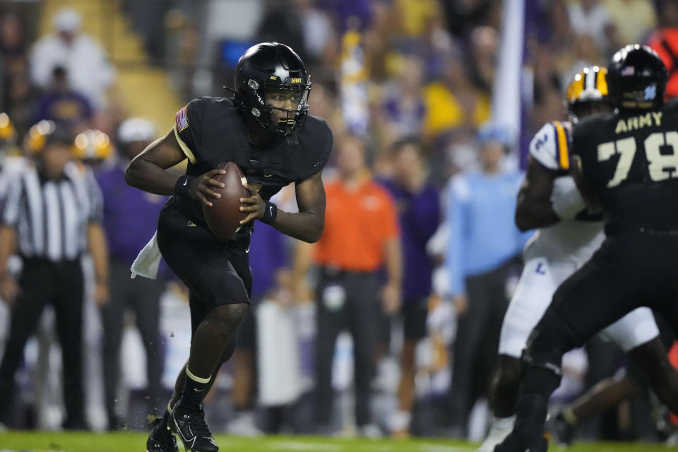 Army quarterback Champ Harris scrambles in the first half of an NCAA college football game against LSU in Baton Rouge, La., Saturday, Oct. 21, 2023. (AP Photo/Gerald Herbert)