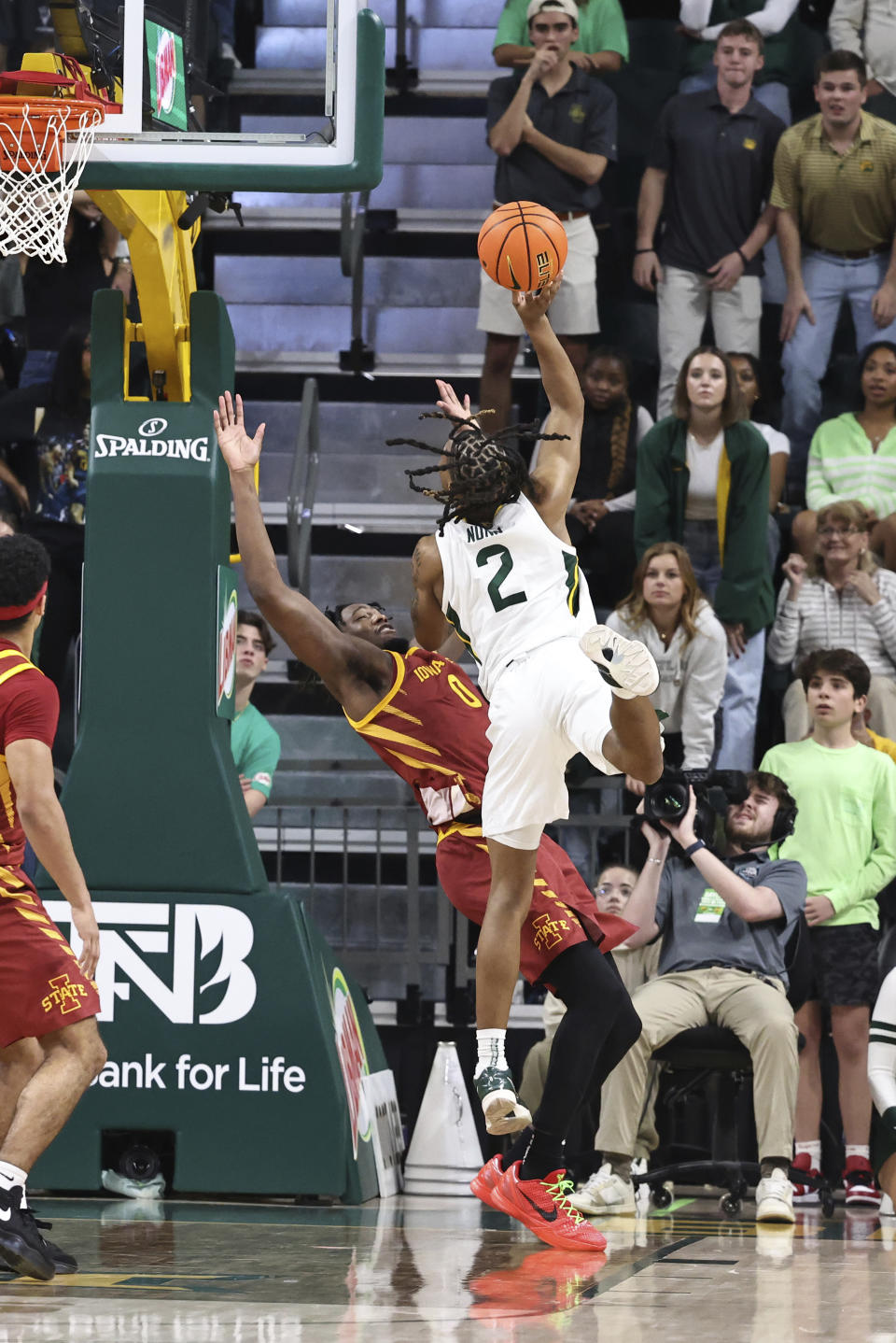 Baylor guard Jayden Nunn (2) goes up to score over Iowa State forward Tre King (0) for the winning basket in the second half of an NCAA college basketball game, Saturday, Feb. 3, 2024, in Waco, Texas. (AP Photo/Rod Aydelotte)