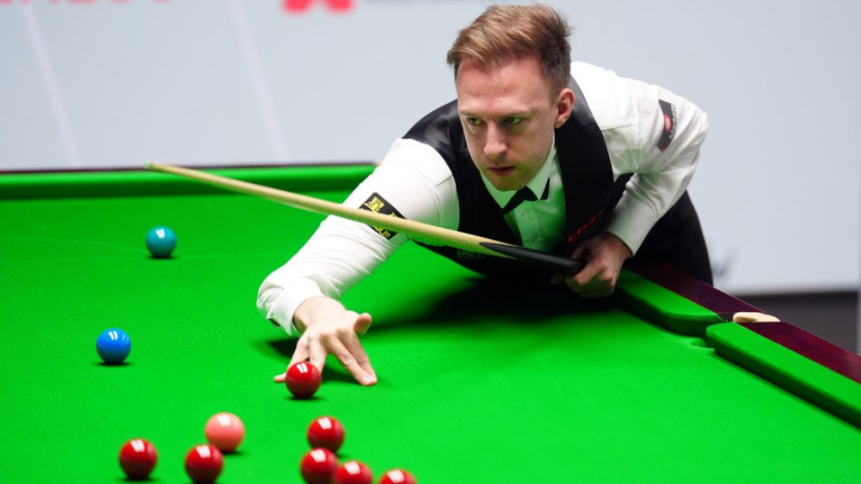 Judd Trump plays a shot