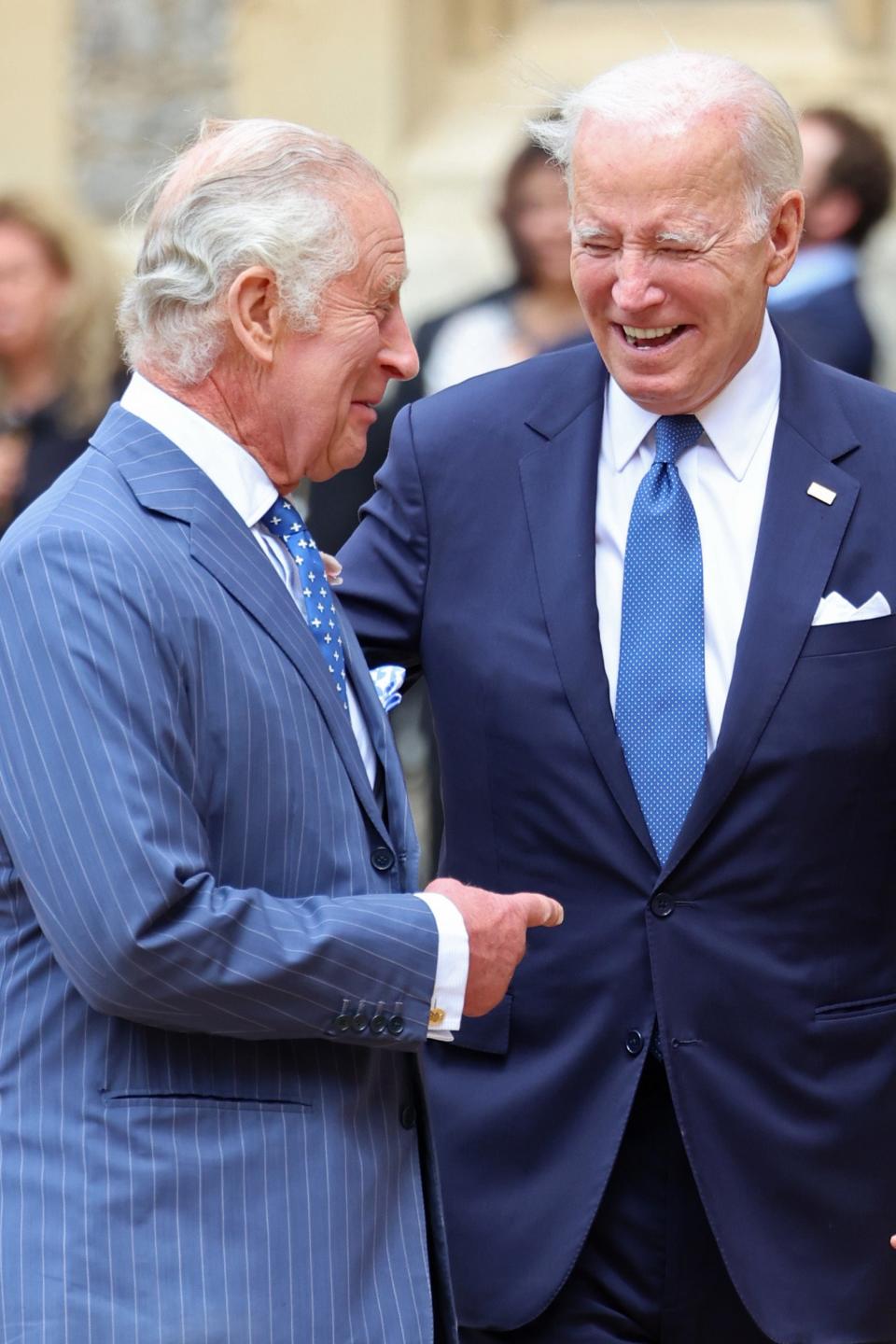 The US president also risked breaking protocol by grabbing Charle’s arm as they shook hands and later putting his hand on his back during their lap of the quadrangle (PA)