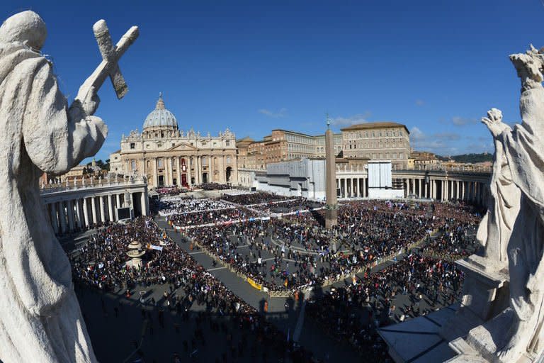 Faithful stand on St Peter's Square prior to Pope Francis's inauguration mass on March 19, 2013 at the Vatican