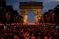 <p>France fans react on the Champs-Elysees after defeating Belgium in their World Cup semi-final match. REUTERS/Charles Platiau </p>