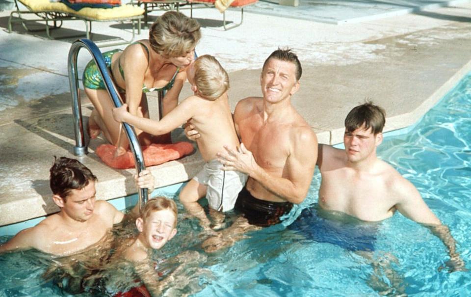 Kirk Douglas pictured with his family during the 1960s - Rex 