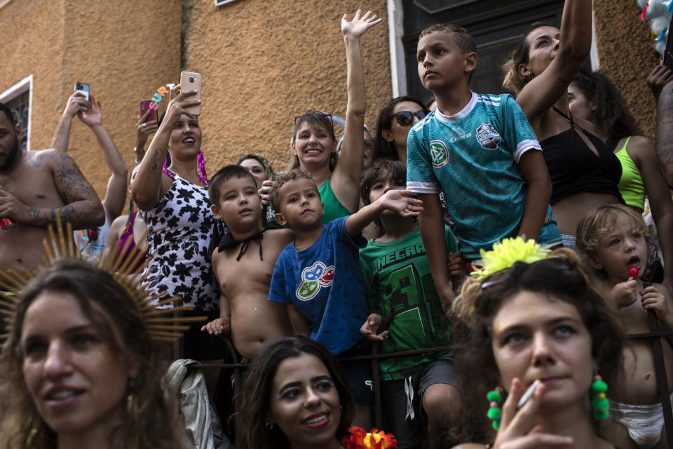 People watch the Carmelitas street party on the first day of Carnival in Rio de Janeiro, Brazil, Friday, Feb. 17, 2023. (AP Photo/Bruna Prado)