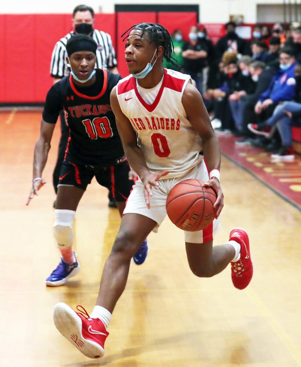 Hamilton's Christian Davis (0) drives to the basket against Tuckahoe during boys basketball playoff action at Alexander Hamilton High School in Elmsford Mar. 1, 2022.