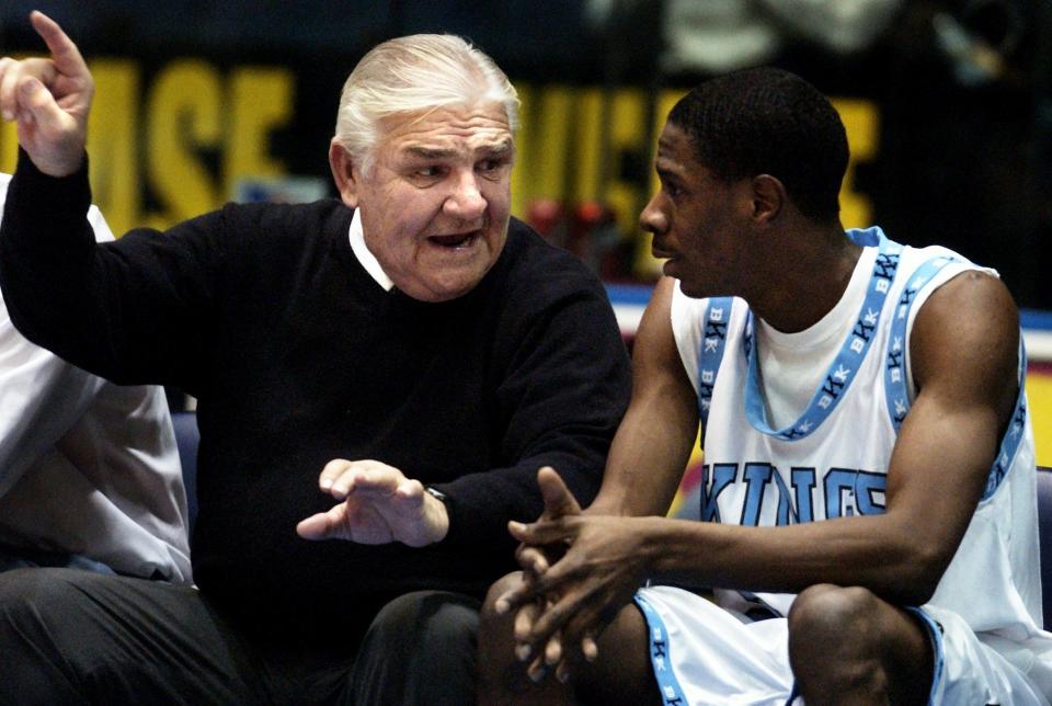 Ed Nietopski coaches AJ White on the bench during a Bishop Kearney game in 2003.