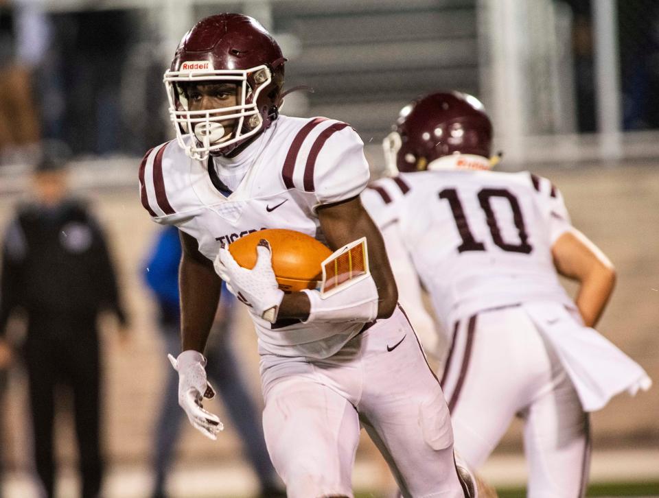 Hardin County's Kaydin Pope runs with the ball against Milan during the first quarter at Johnnie Hale Stadium in Milan, Tenn., Friday, Oct. 23, 2020.  